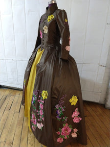 Brown silk dress with heavy floral decoration